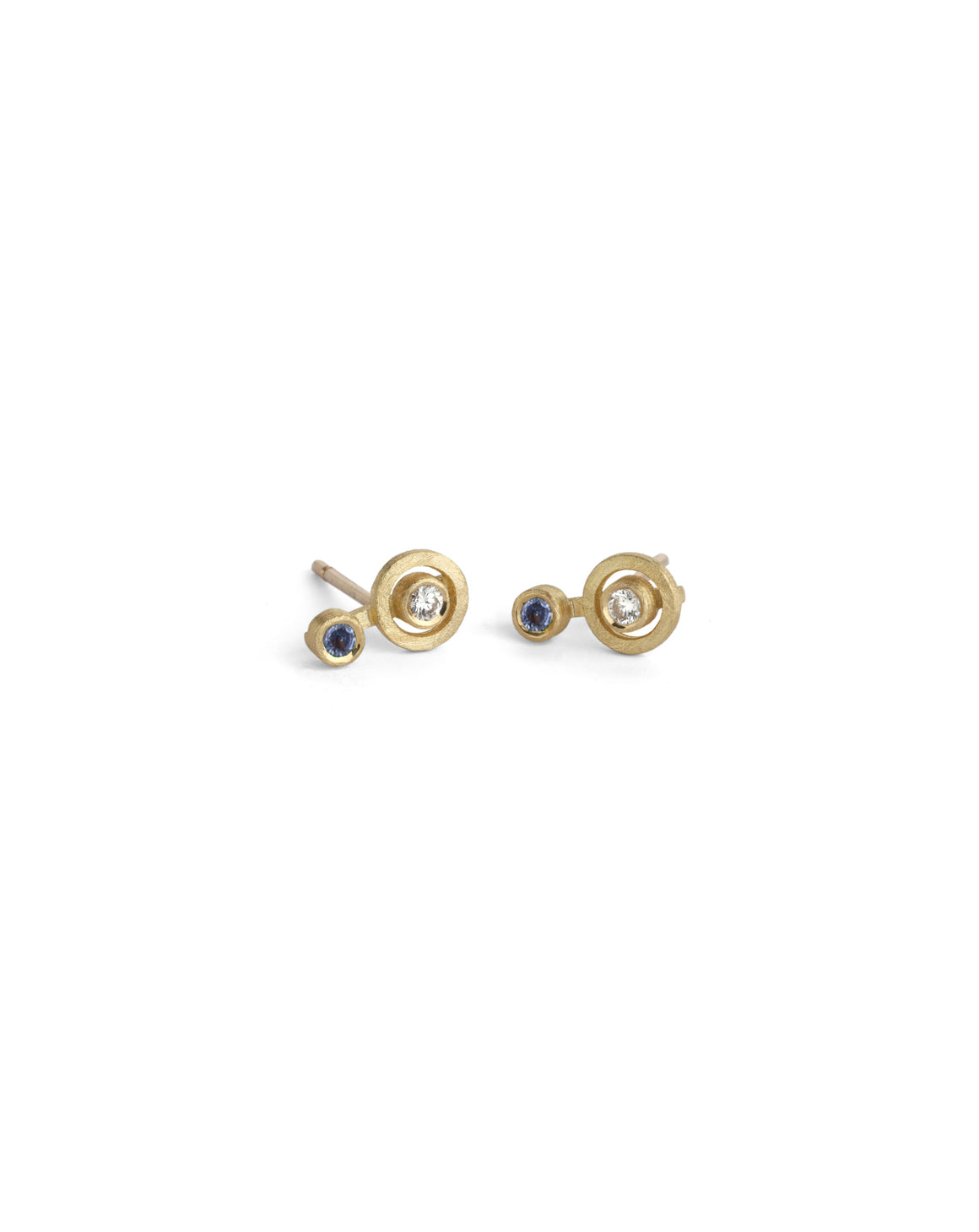 Ear studs with circular detail set with blue sapphires and white diamond. 