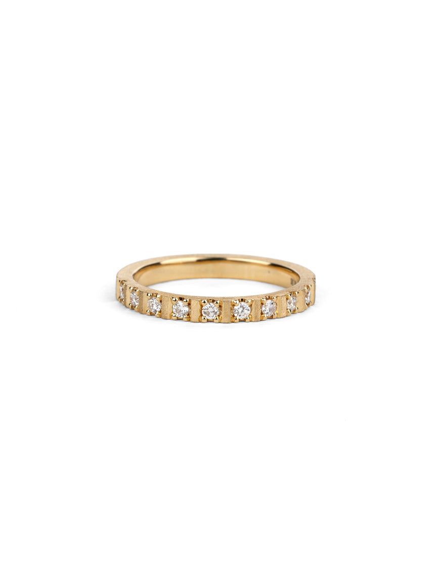 Band set with ten white diamonds. 18ct yellow gold with a textured finish.