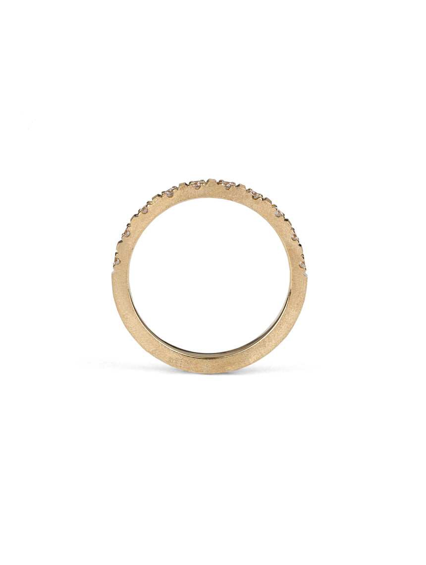 Band set with ten white diamonds. 18ct yellow gold with a textured finish. Side profile.