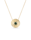 A pendant with round green sapphire surrounded by three circles. 18c yellow gold, textured finish.