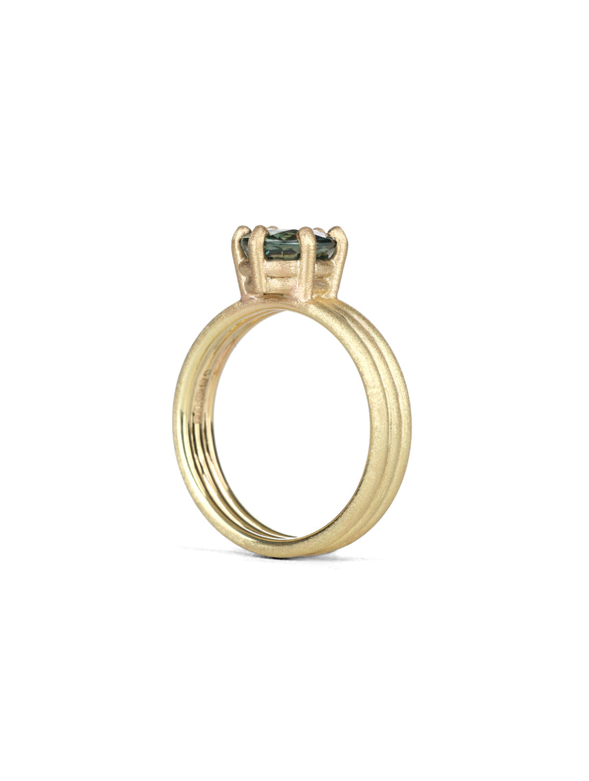 Oval green sapphire ring with six claw setting. Joined triple band, 18t yellow gold, textured finish. Side view.