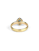 Solitaire ring in satin 18ct yellow gold with an oval teal sapphire, back view