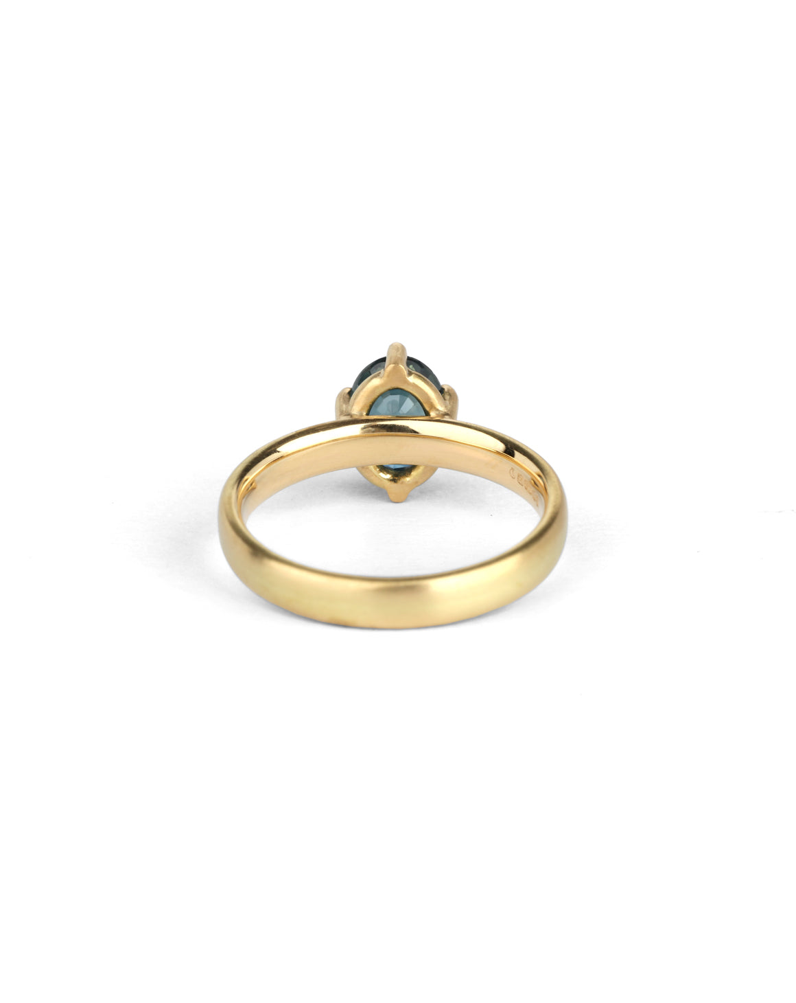 Solitaire ring in satin 18ct yellow gold with an oval teal sapphire, back view