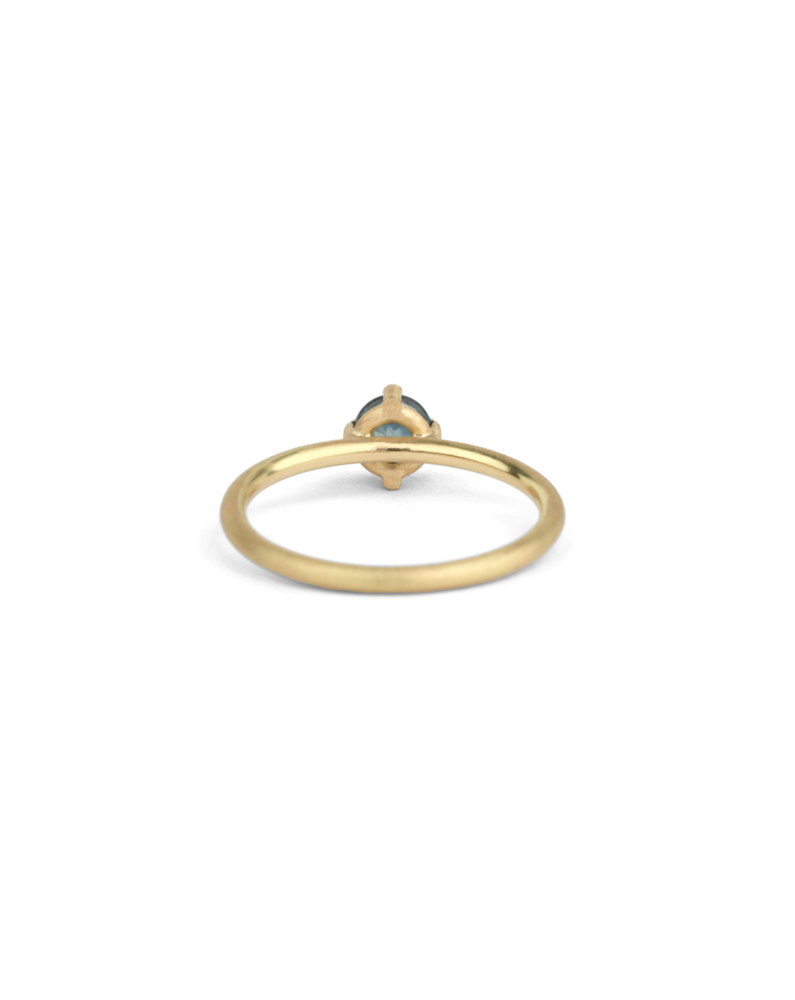 Solitaire ring in textured 18ct yellow gold with a round teal sapphire, back view