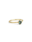 Solitaire ring in textured 18ct yellow gold with a round teal sapphire