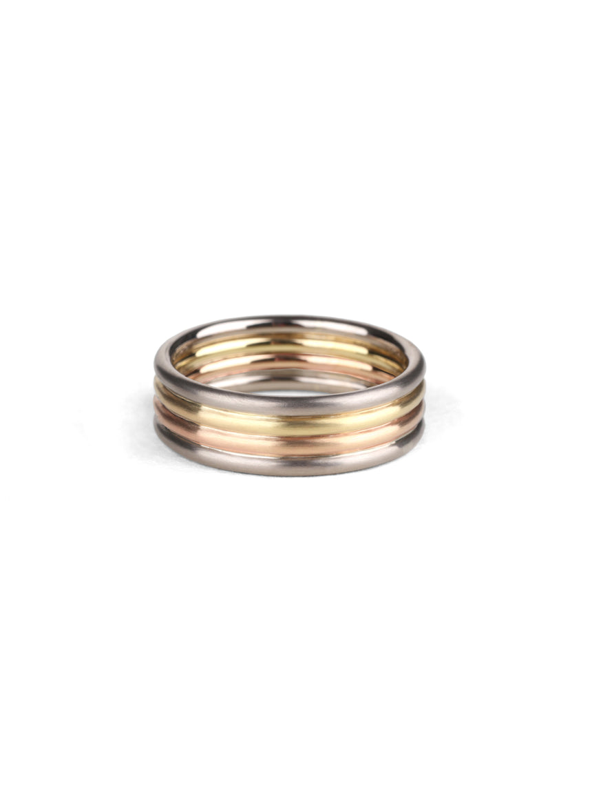 Wedding ring, four joined bands. 18ct yellow, white and rose gold, satin finish.